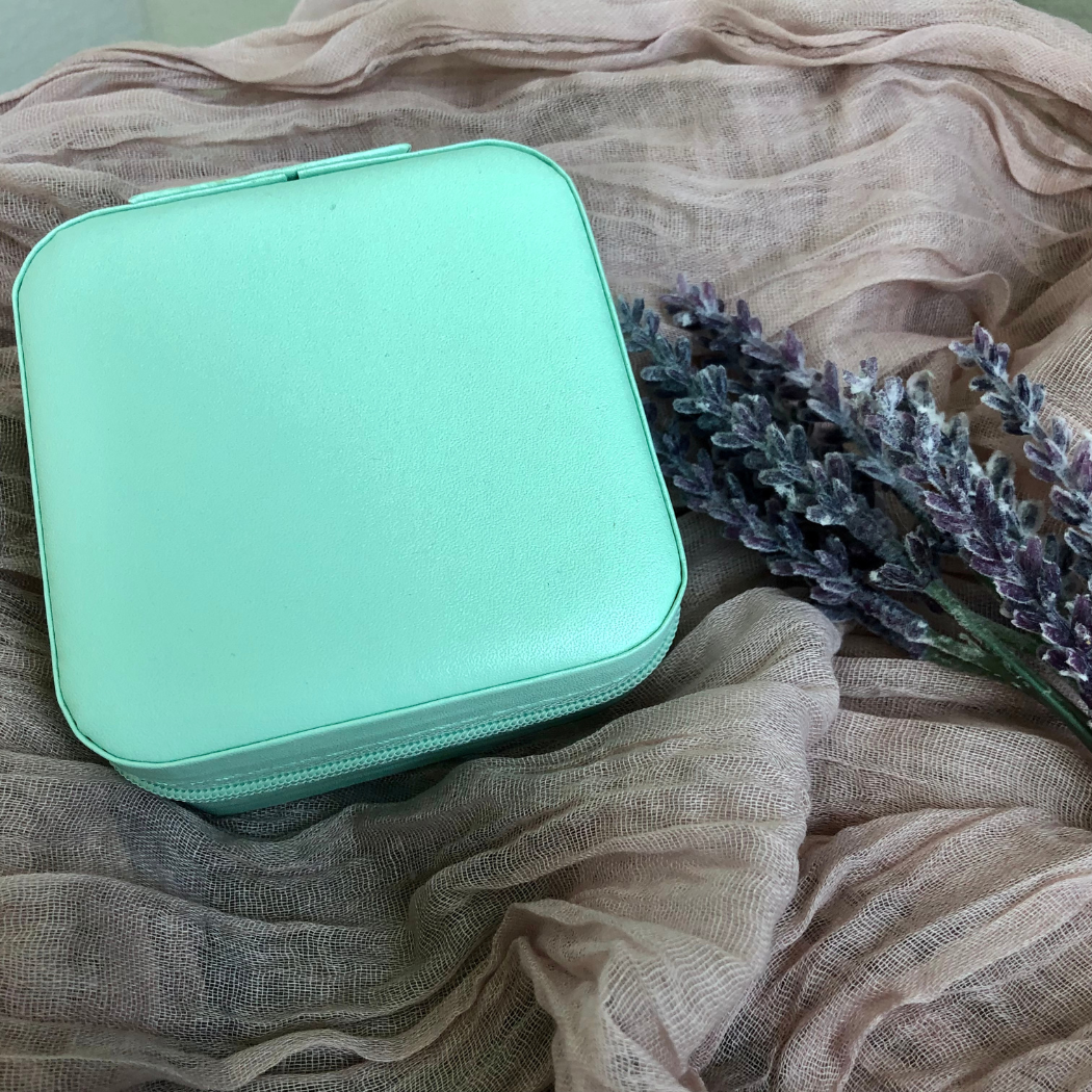 Compact PU leather jewelry organizer in teal.