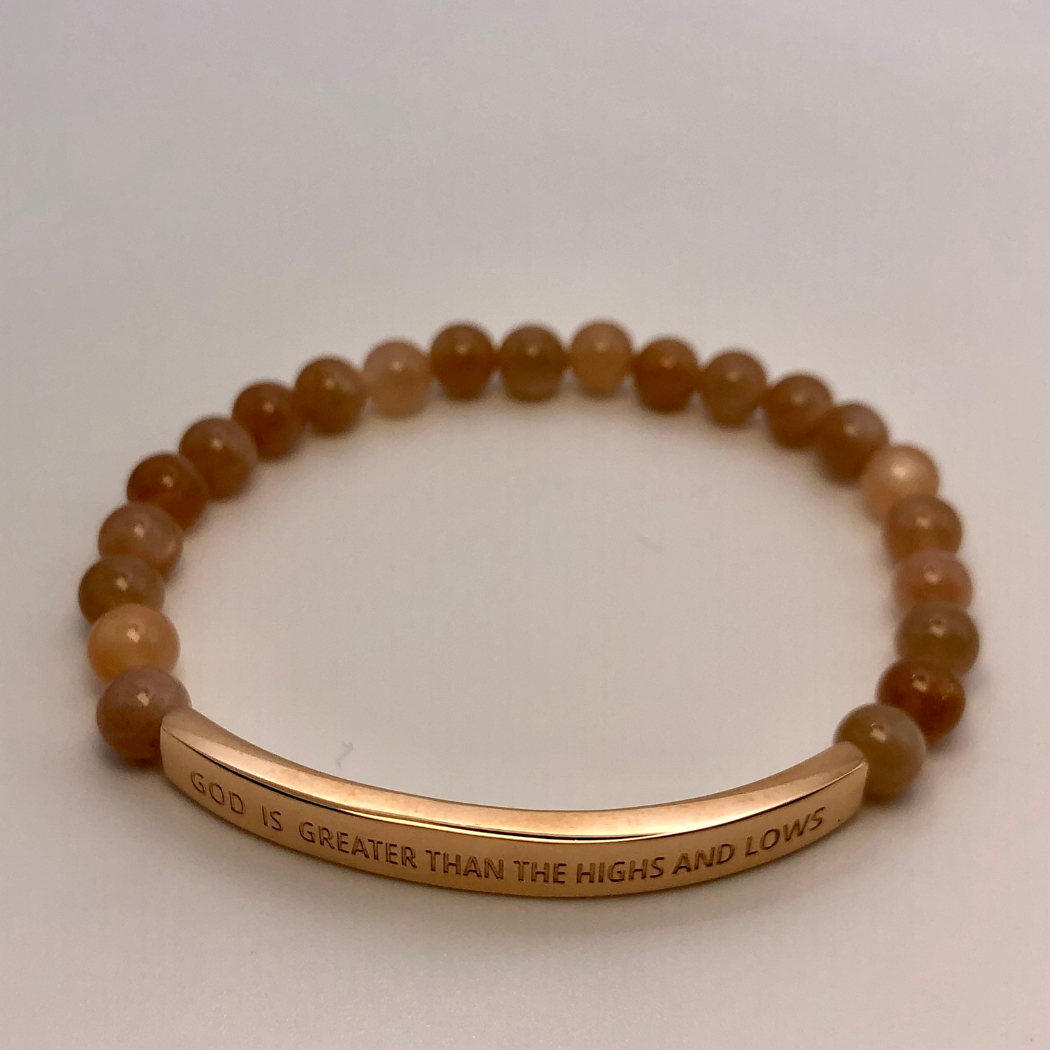 Gemstone bead bracelet with the message 'God Is Greater Than The Highs And Lows' .