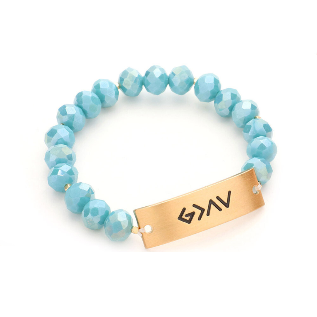 An image of a trendy bracelet with sparkling stretch beads, showcasing the powerful message "God is greater than the highs and lows".