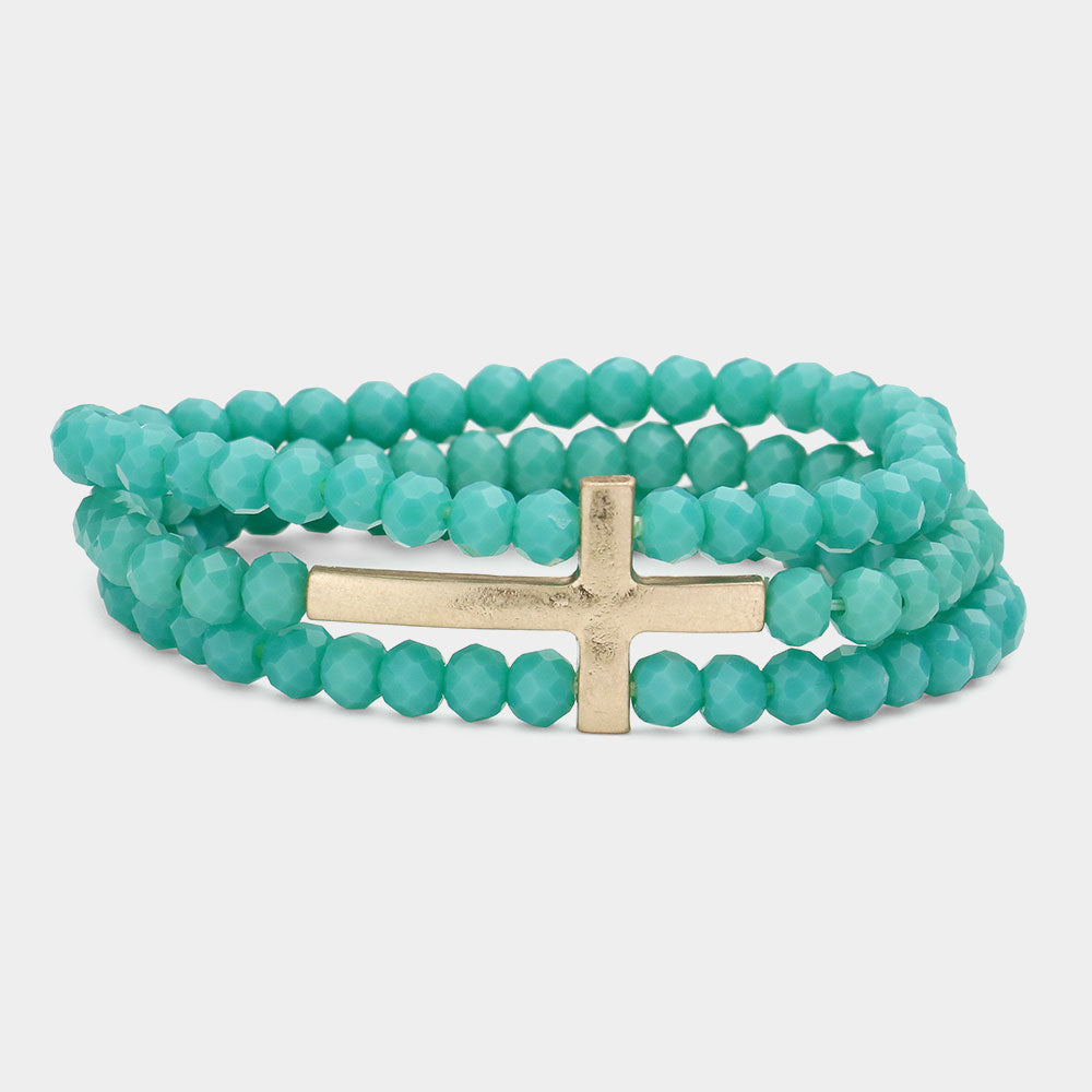 Turquoise stretch bracelet with a stylish metal cross accent